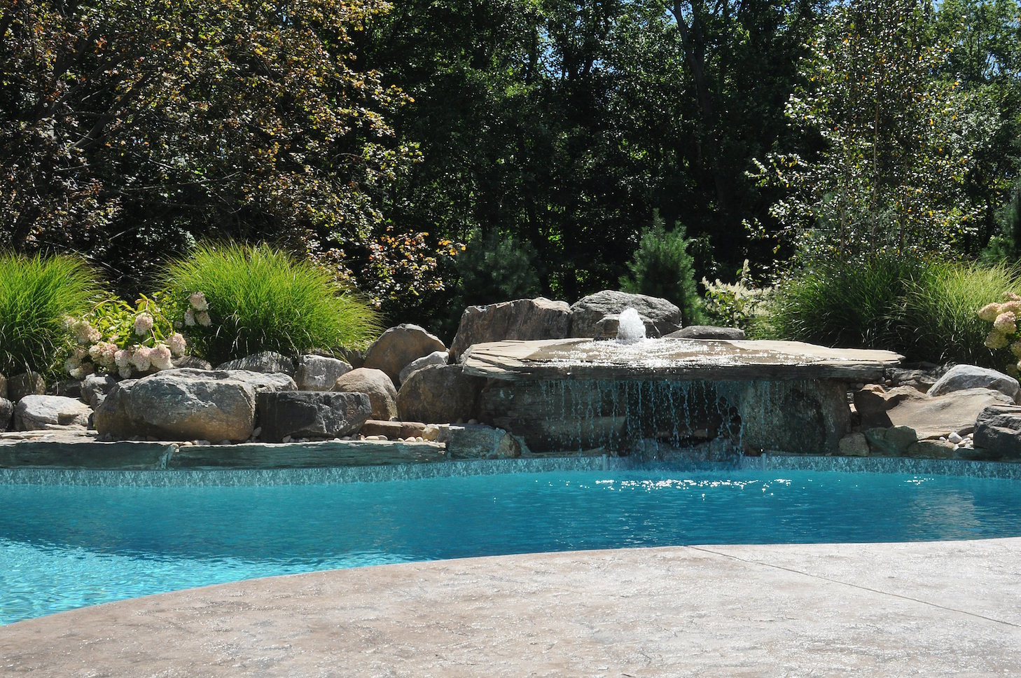 Finished outdoor water feature with balanced materials and site integration
